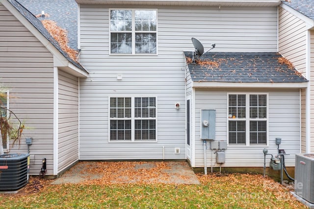 back of property with central AC unit