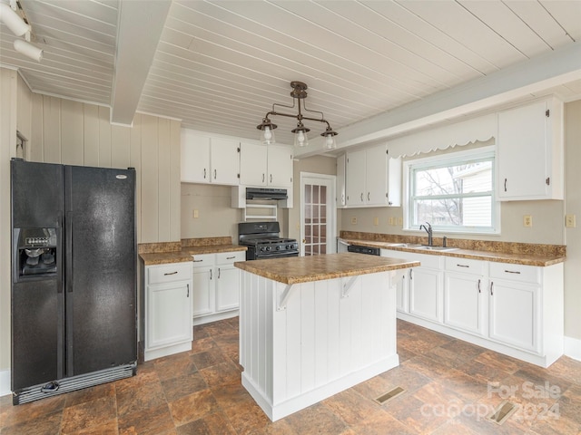 kitchen with sink, white cabinetry, and black appliances