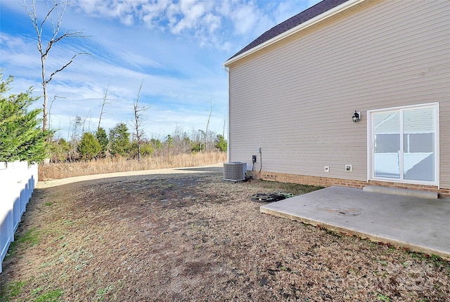 view of yard featuring a patio and central AC