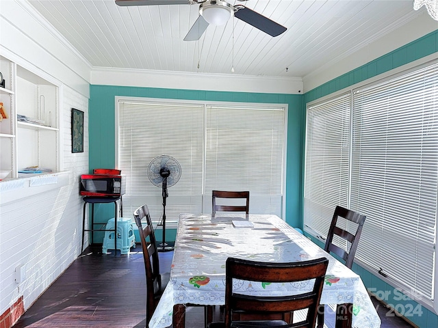 dining area with dark hardwood / wood-style flooring, ornamental molding, wood ceiling, brick wall, and ceiling fan