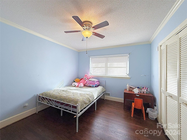 bedroom with a closet, ceiling fan, dark hardwood / wood-style flooring, and crown molding