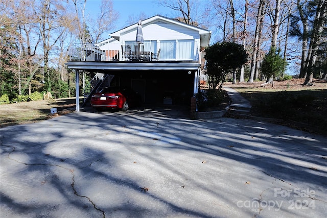 view of side of home with a carport