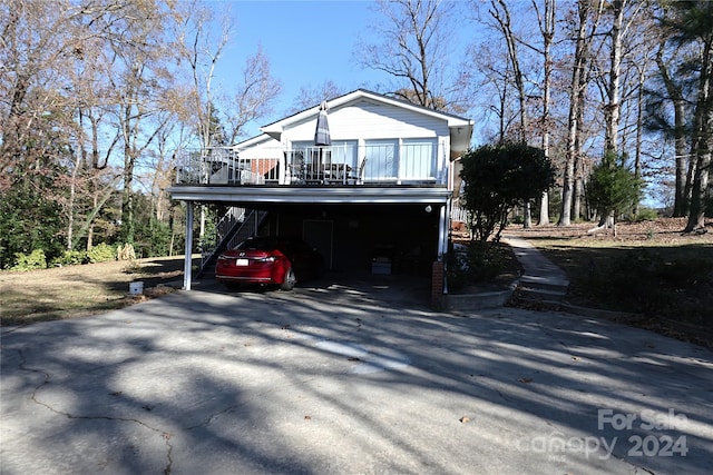 view of property exterior with a carport