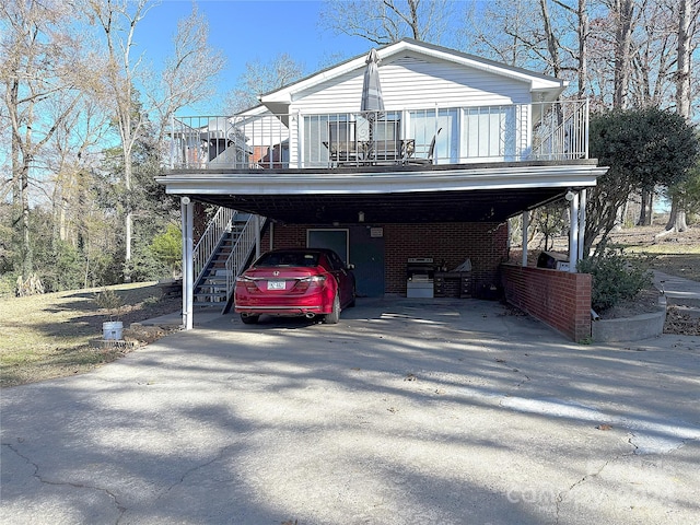 view of front of house with a carport and a balcony