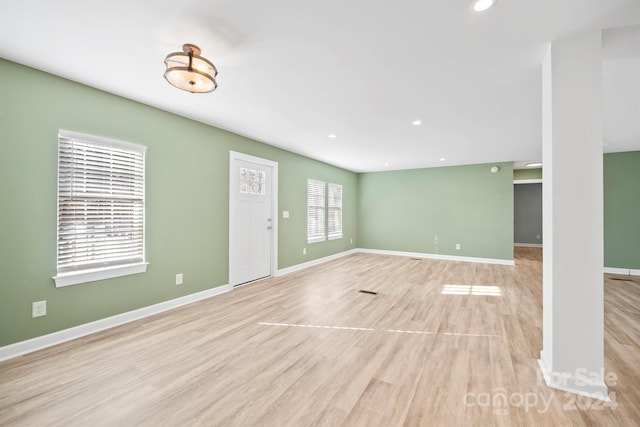 unfurnished living room with light hardwood / wood-style floors