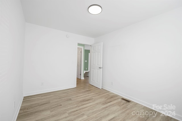 spare room with light hardwood / wood-style floors