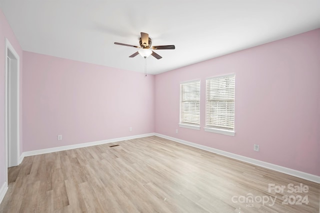 unfurnished room featuring ceiling fan and light wood-type flooring