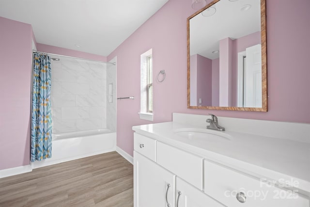 bathroom featuring shower / bathtub combination with curtain, hardwood / wood-style floors, and vanity