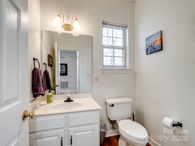 bathroom with vanity and toilet