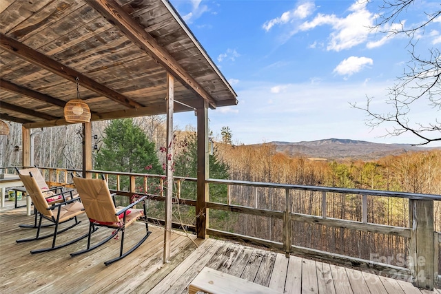 wooden terrace with a mountain view