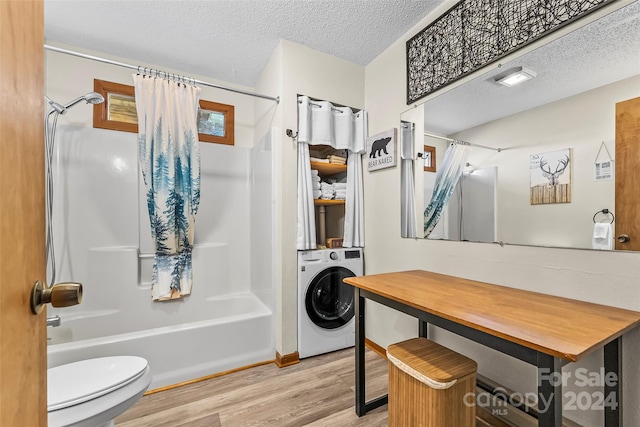 bathroom with hardwood / wood-style flooring, toilet, a textured ceiling, washer / dryer, and shower / tub combo