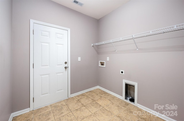 clothes washing area featuring electric dryer hookup and hookup for a washing machine