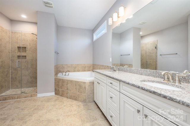 bathroom featuring vanity and shower with separate bathtub