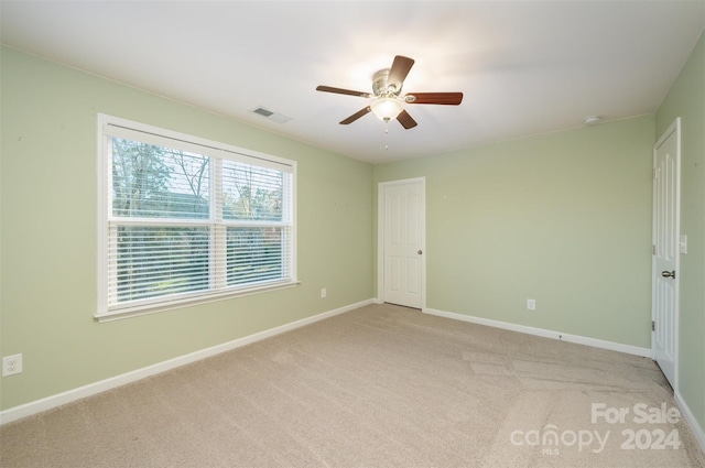 carpeted empty room with ceiling fan