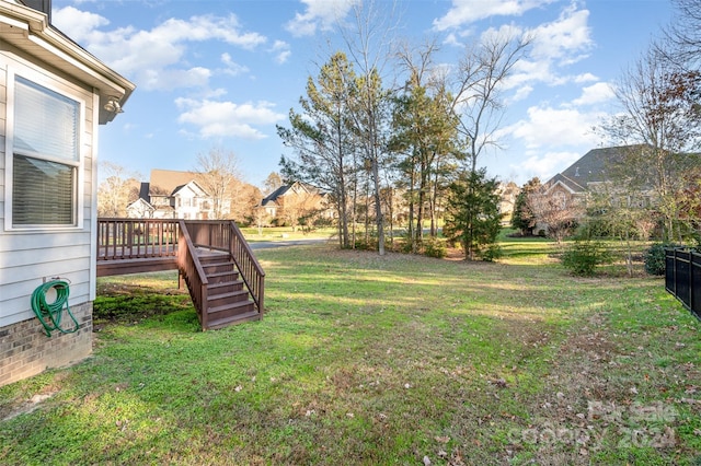 view of yard with a wooden deck