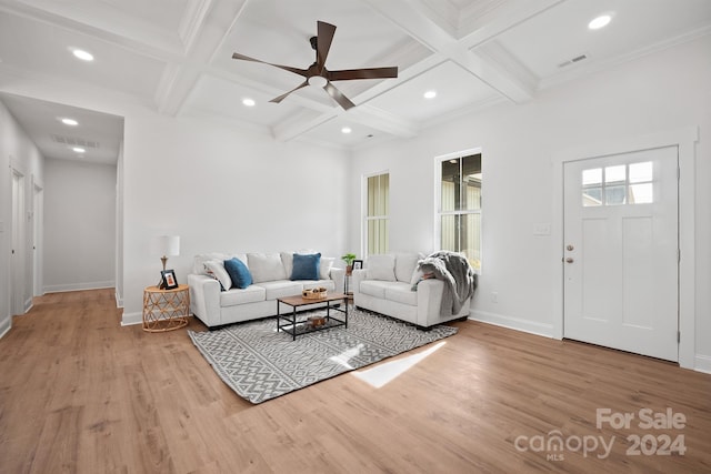 living room featuring ceiling fan, light hardwood / wood-style flooring, beamed ceiling, and coffered ceiling