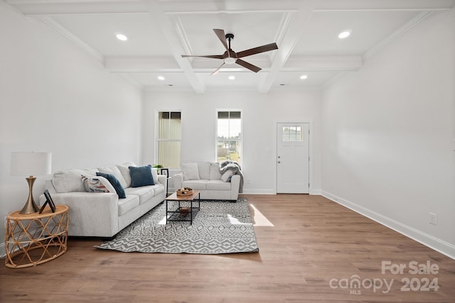 living room featuring beamed ceiling, hardwood / wood-style flooring, ceiling fan, and coffered ceiling