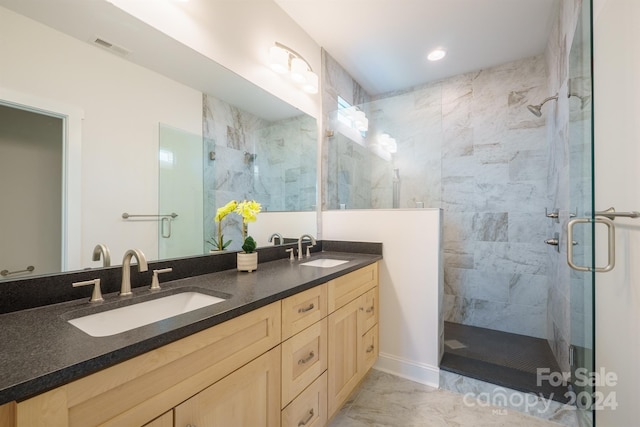 bathroom with vanity and walk in shower