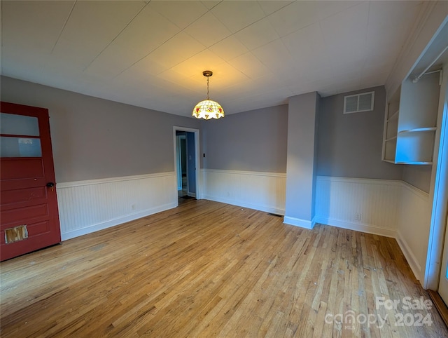 spare room with light wood-type flooring