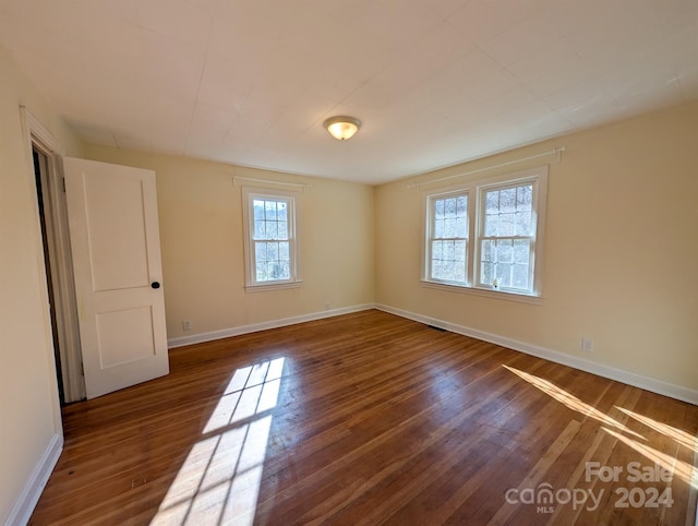 empty room featuring dark hardwood / wood-style floors