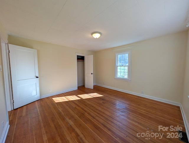 unfurnished bedroom featuring hardwood / wood-style floors