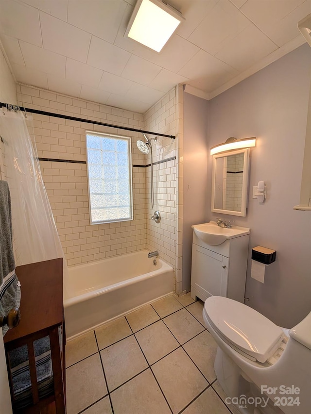 full bathroom featuring vanity, shower / bath combination with curtain, crown molding, tile patterned flooring, and toilet