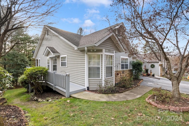 view of property exterior featuring a lawn