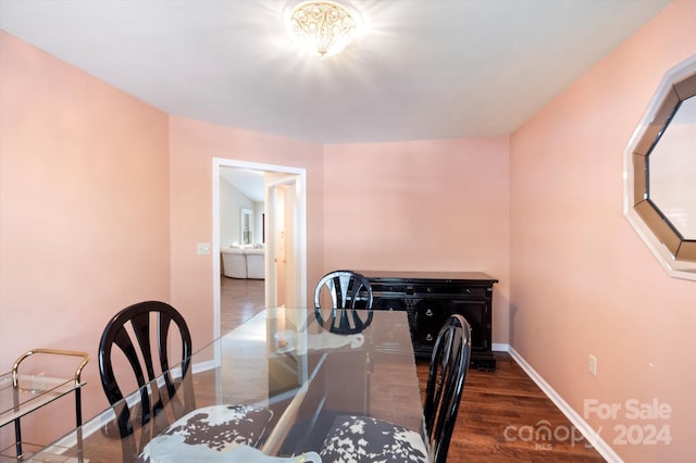 dining space featuring dark hardwood / wood-style flooring