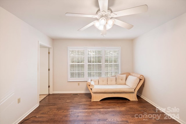 unfurnished room featuring ceiling fan and dark wood-type flooring