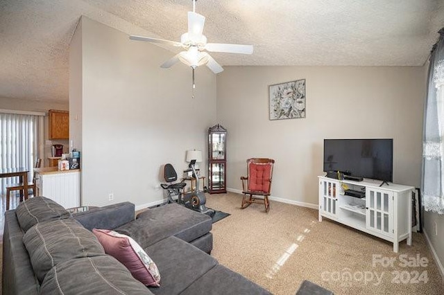 carpeted living room with a textured ceiling, ceiling fan, and lofted ceiling