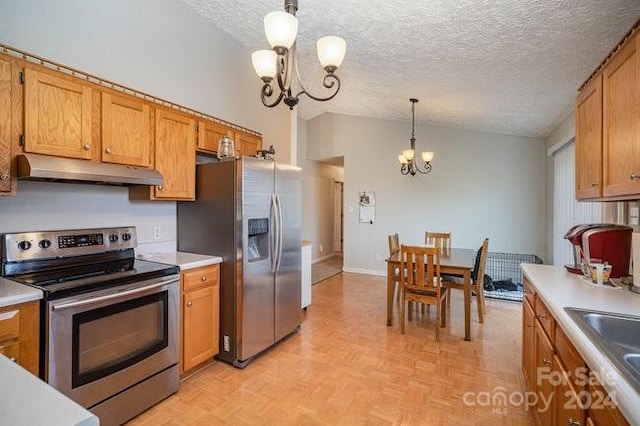 kitchen featuring a notable chandelier, a textured ceiling, decorative light fixtures, light parquet flooring, and appliances with stainless steel finishes