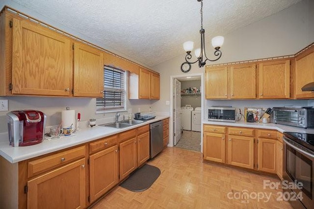 kitchen with stainless steel appliances, sink, washer and dryer, a chandelier, and lofted ceiling