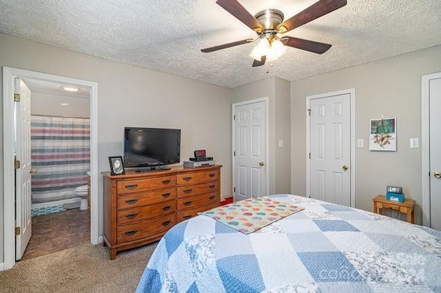 bedroom with ceiling fan, light colored carpet, and a textured ceiling