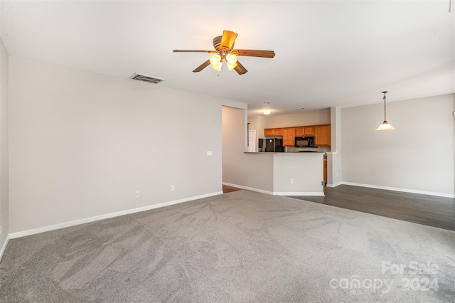12039 Windy Rock Way, Charlotte, NC 28273 - unfurnished living room with dark hardwood / wood-style floors and ceiling fan