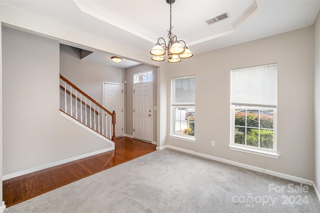 12039 Windy Rock Way, Charlotte, NC 28273 - entrance foyer with a tray ceiling, dark hardwood / wood-style flooring, a notable chandelier, and ornamental molding