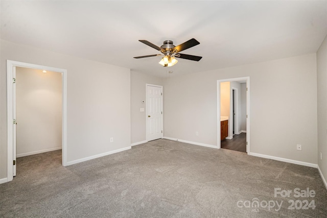 12039 Windy Rock Way, Charlotte, NC 28273 - unfurnished bedroom featuring ceiling fan, dark carpet, ensuite bathroom, and a closet