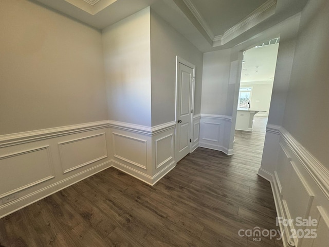 corridor featuring crown molding and dark hardwood / wood-style floors