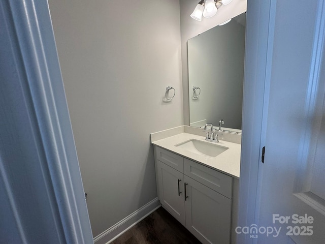 bathroom featuring vanity and hardwood / wood-style flooring