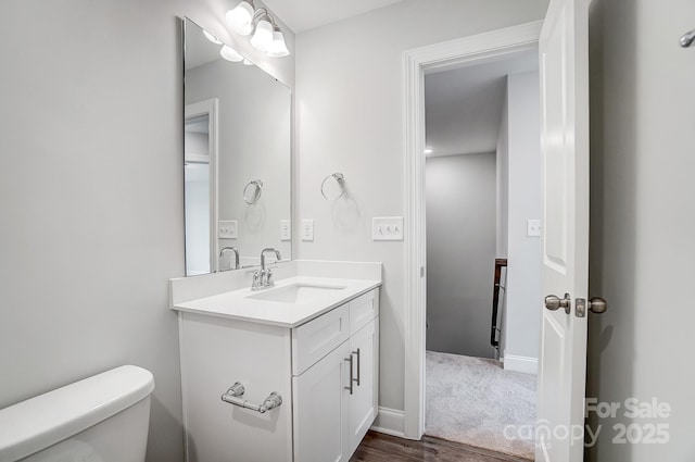 bathroom with toilet and vanity