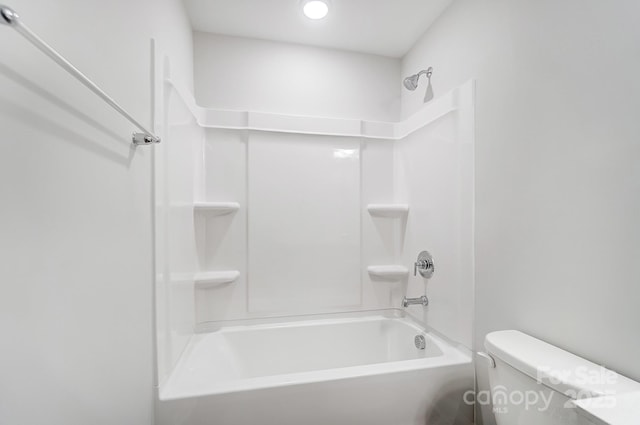 bathroom with tub / shower combination and toilet