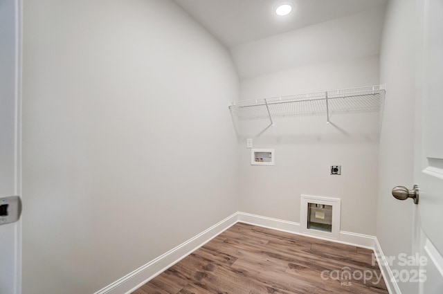 laundry area with hardwood / wood-style floors, hookup for a washing machine, and hookup for an electric dryer