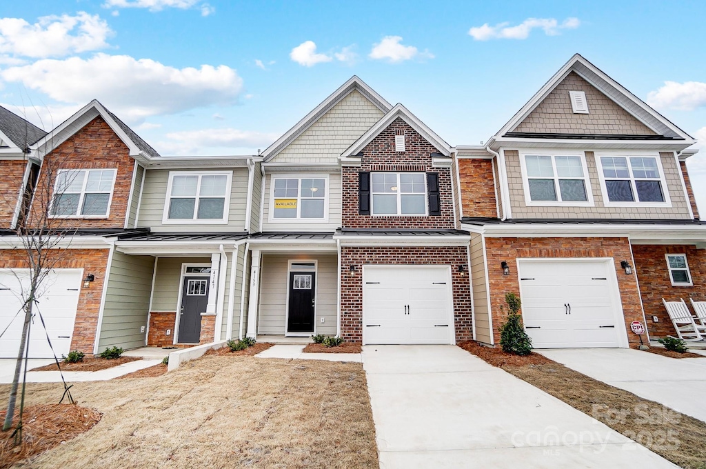 townhome / multi-family property featuring a garage