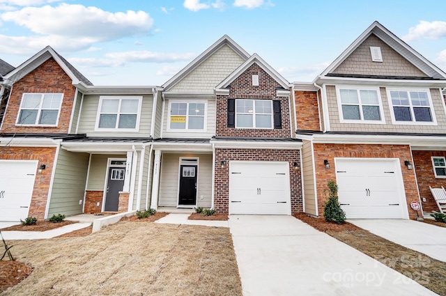 townhome / multi-family property featuring a garage