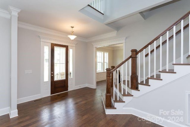 foyer entrance featuring dark hardwood / wood-style floors and crown molding