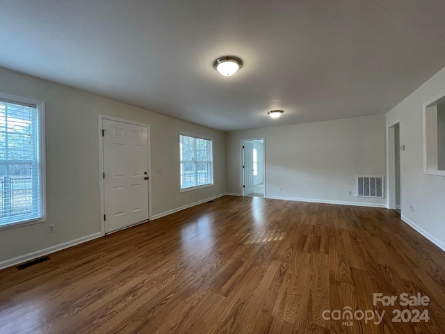 interior space with dark hardwood / wood-style floors