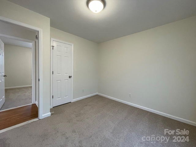 empty room with carpet flooring