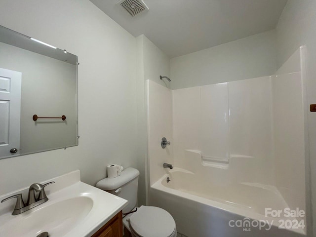 full bathroom with vanity, toilet, and washtub / shower combination