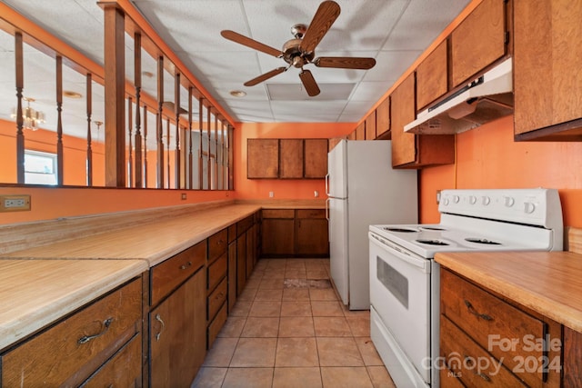 kitchen featuring white range with electric stovetop, ceiling fan, and light tile patterned flooring