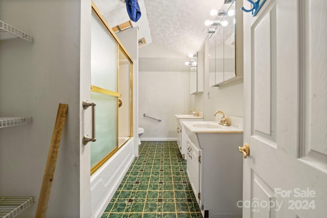 full bathroom featuring vanity, bath / shower combo with glass door, and toilet