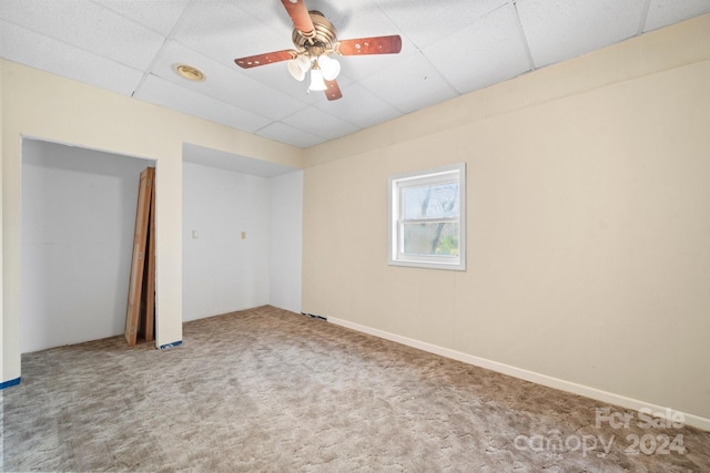 interior space featuring a paneled ceiling and ceiling fan